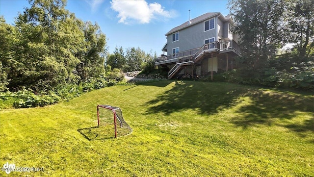2436 N Hope Cir, Palmer, AK 99645 - view of green lawn with stairway and a wooden deck