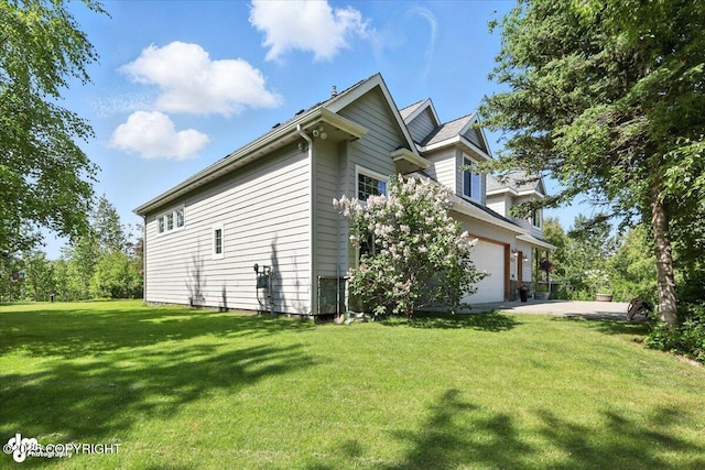 2436 N Hope Cir, Palmer, AK 99645 - view of side of property with an attached garage, a yard, and concrete driveway