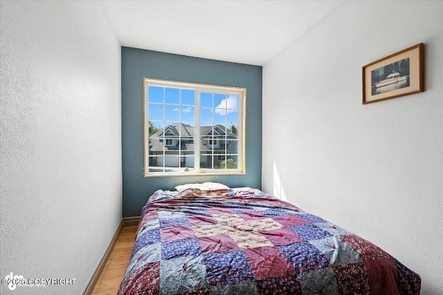 2436 N Hope Cir, Palmer, AK 99645 - bedroom with light wood finished floors and a textured wall