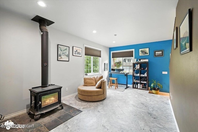 2436 N Hope Cir, Palmer, AK 99645 - sitting room featuring a wood stove and recessed lighting