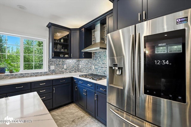 2436 N Hope Cir, Palmer, AK 99645 - kitchen with stainless steel appliances, wall chimney range hood, light countertops, and backsplash
