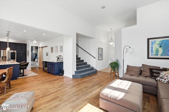2436 N Hope Cir, Palmer, AK 99645 - living room with stairway, light wood finished floors, recessed lighting, and a barn door