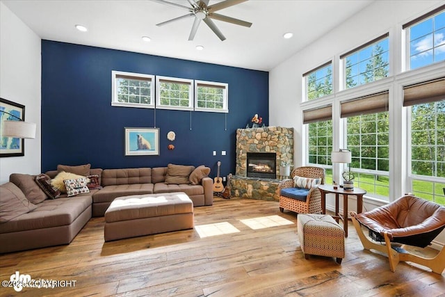 2436 N Hope Cir, Palmer, AK 99645 - living room with hardwood / wood-style floors, a ceiling fan, recessed lighting, and a stone fireplace