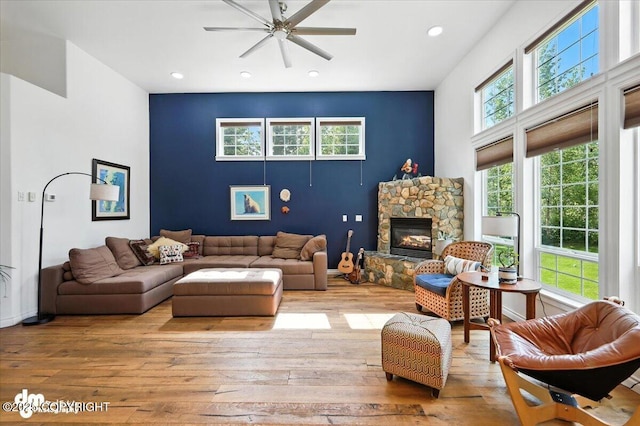 2436 N Hope Cir, Palmer, AK 99645 - living room with ceiling fan, wood-type flooring, a stone fireplace, and recessed lighting
