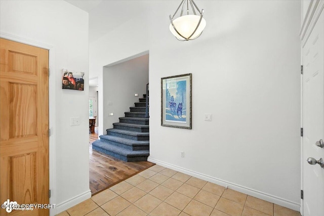 2436 N Hope Cir, Palmer, AK 99645 - foyer entrance with light tile patterned floors and stairway