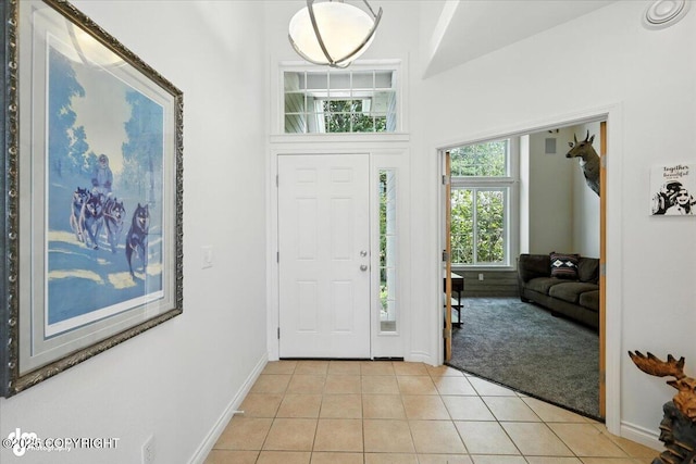 2436 N Hope Cir, Palmer, AK 99645 - entryway with light tile patterned floors and light colored carpet