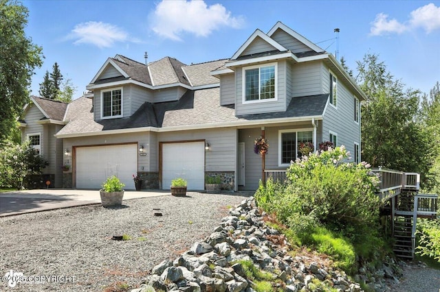 2436 N Hope Cir, Palmer, AK 99645 - view of front of house featuring concrete driveway, roof with shingles, stone siding, stairway, and a garage