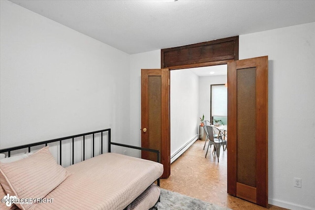 2634 Forest Park Dr # 114, Anchorage, AK 99517 - bedroom featuring a baseboard radiator and light floors