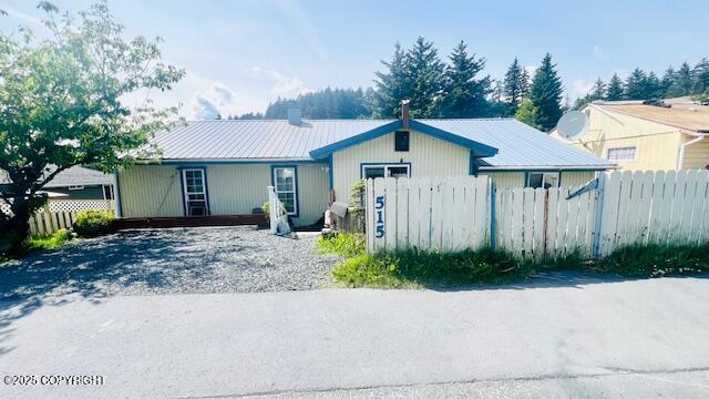 515 Maple Ave, Kodiak, AK 99615 - ranch-style house with a metal roof and a chimney