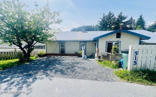 515 Maple Ave, Kodiak, AK 99615 - ranch-style house with a metal roof, a chimney, and driveway