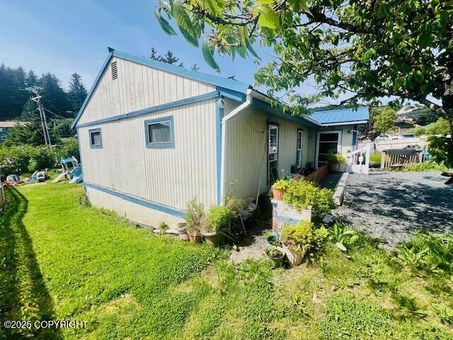 515 Maple Ave, Kodiak, AK 99615 - view of home's exterior with a yard