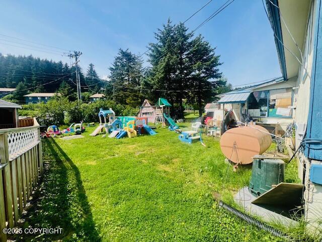 515 Maple Ave, Kodiak, AK 99615 - view of grassy yard featuring a playground