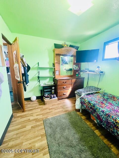 515 Maple Ave, Kodiak, AK 99615 - bedroom featuring wood finished floors and baseboards