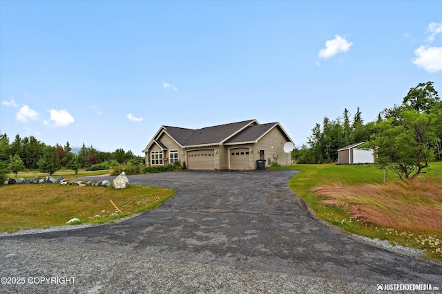 3827 E Country Field Cir, Wasilla, AK 99654 - view of front of home featuring an attached garage, a front yard, and driveway