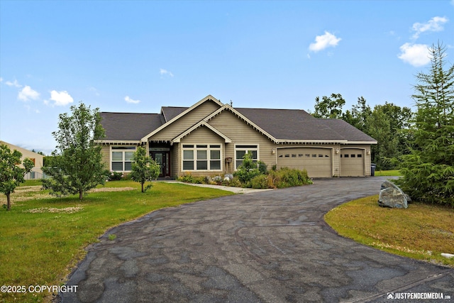 3827 E Country Field Cir, Wasilla, AK 99654 - view of front of home with an attached garage, driveway, a front yard, and a shingled roof