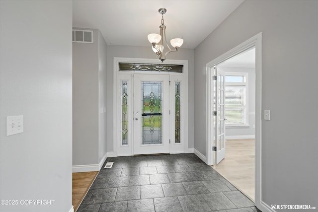 3827 E Country Field Cir, Wasilla, AK 99654 - foyer with a chandelier and stone tile floors