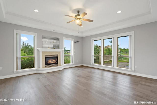 3827 E Country Field Cir, Wasilla, AK 99654 - unfurnished living room with a raised ceiling, ceiling fan, healthy amount of natural light, and recessed lighting