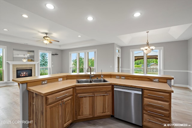 3827 E Country Field Cir, Wasilla, AK 99654 - kitchen with dishwasher, a raised ceiling, open floor plan, plenty of natural light, and recessed lighting