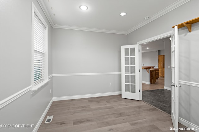 3827 E Country Field Cir, Wasilla, AK 99654 - empty room with french doors, recessed lighting, wood finished floors, and crown molding