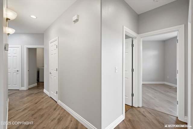 3827 E Country Field Cir, Wasilla, AK 99654 - corridor with light wood finished floors and baseboards