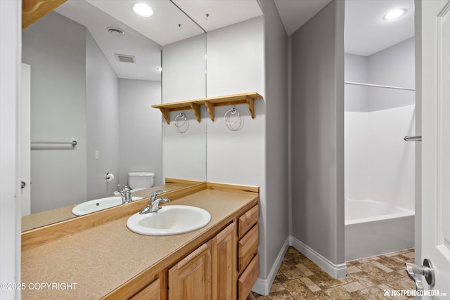 3827 E Country Field Cir, Wasilla, AK 99654 - full bath with vanity, shower / bathtub combination, stone finish flooring, and recessed lighting