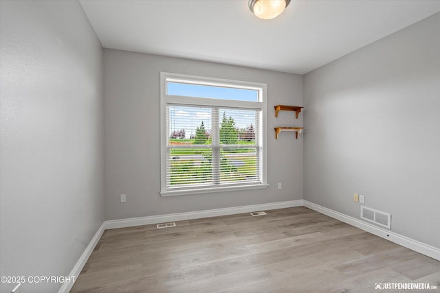 3827 E Country Field Cir, Wasilla, AK 99654 - empty room with light wood-style floors and baseboards