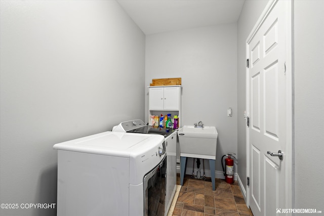 3827 E Country Field Cir, Wasilla, AK 99654 - laundry area featuring washing machine and clothes dryer and cabinet space