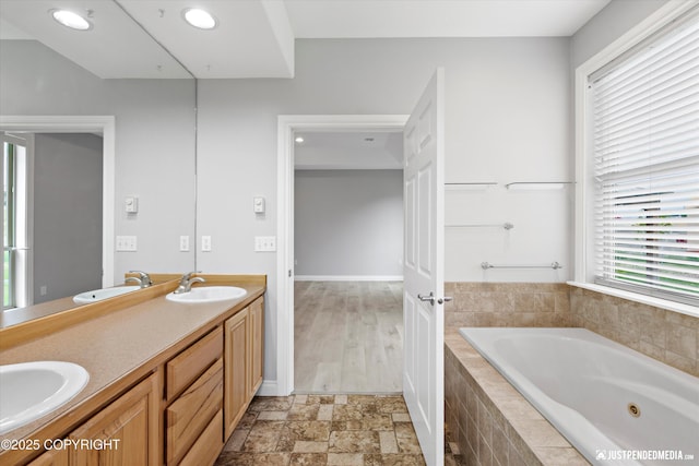 3827 E Country Field Cir, Wasilla, AK 99654 - full bathroom with a tub with jets, double vanity, and recessed lighting
