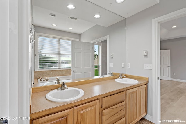 3827 E Country Field Cir, Wasilla, AK 99654 - full bath featuring double vanity, a bath, and recessed lighting