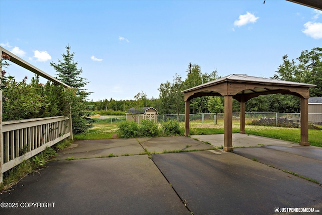 3827 E Country Field Cir, Wasilla, AK 99654 - view of patio with a gazebo and a storage shed