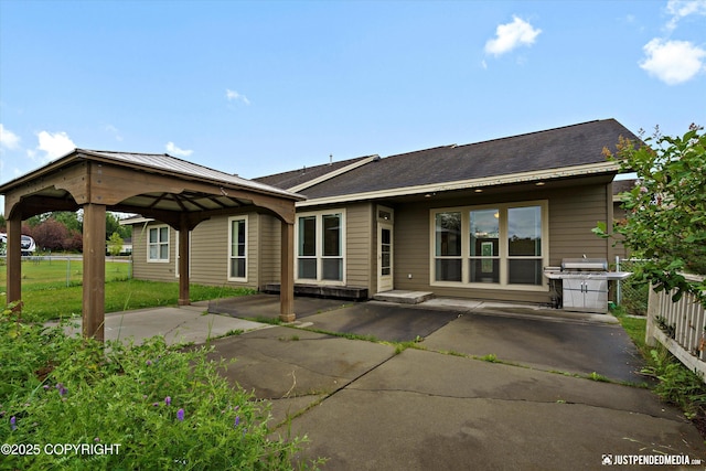 3827 E Country Field Cir, Wasilla, AK 99654 - back of house with a gazebo and a patio