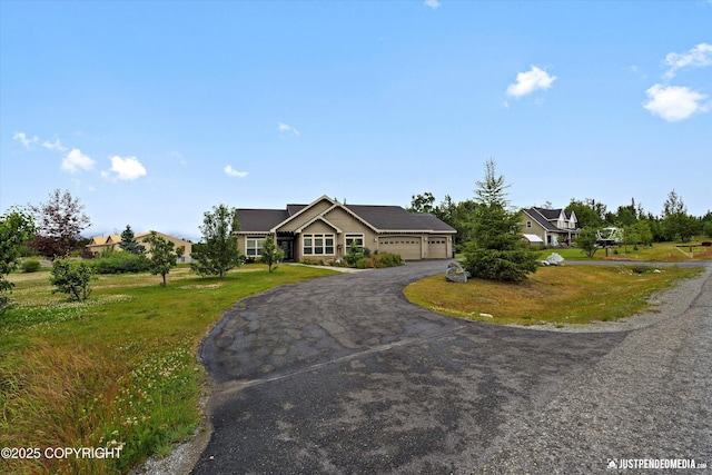 3827 E Country Field Cir, Wasilla, AK 99654 - view of front of house with a garage, driveway, and a front yard