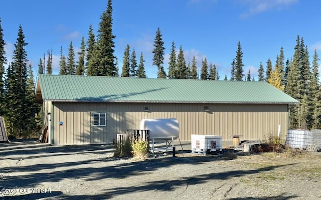 21635 Renault St, Kasilof, AK 99610 - view of property exterior featuring a metal roof and an outbuilding