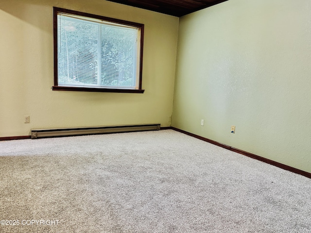 9238 Emily Way, Juneau, AK 99801 - carpeted spare room with a baseboard heating unit and baseboards