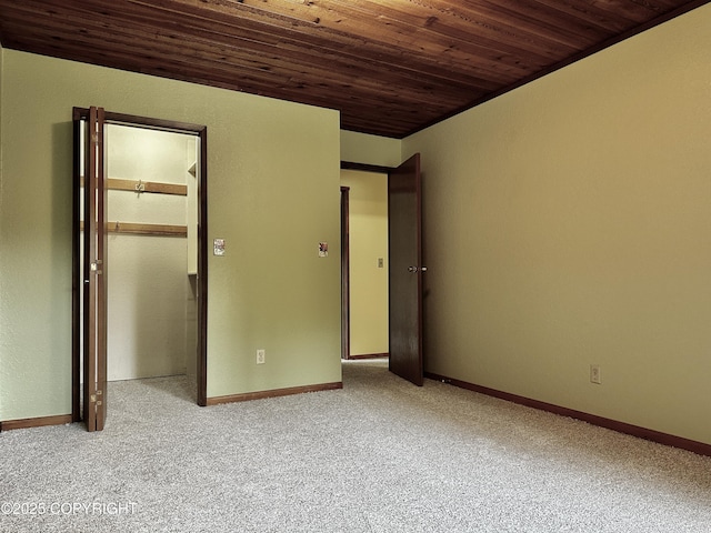 9238 Emily Way, Juneau, AK 99801 - unfurnished bedroom with wooden ceiling, carpet floors, and a closet