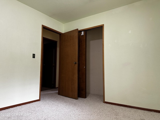 9238 Emily Way, Juneau, AK 99801 - unfurnished bedroom with light carpet and a closet