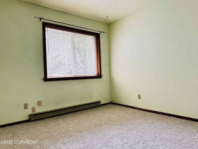9238 Emily Way, Juneau, AK 99801 - carpeted empty room with a baseboard radiator and baseboards