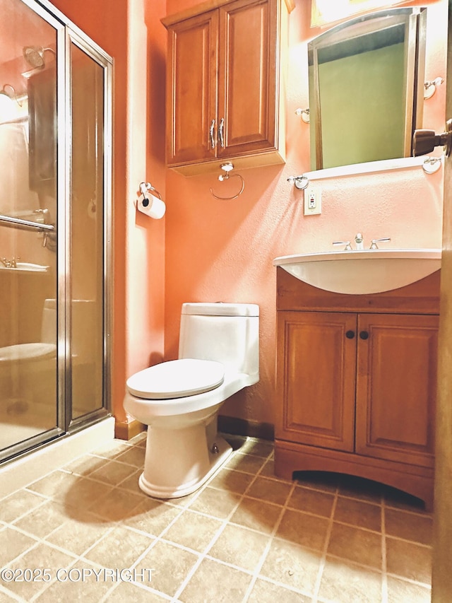 9238 Emily Way, Juneau, AK 99801 - bathroom featuring vanity, a shower stall, and tile patterned flooring