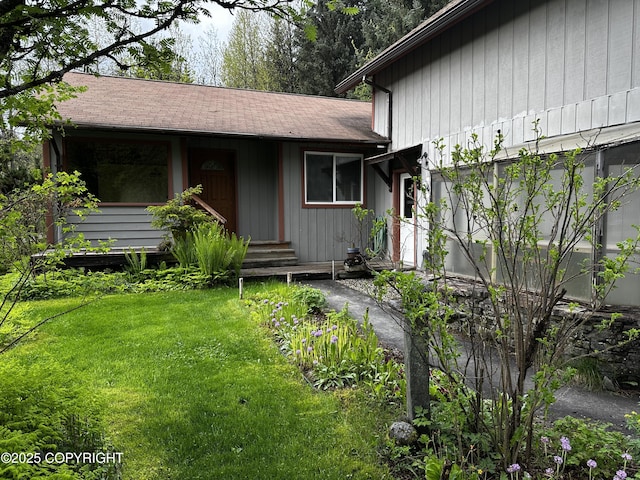 9238 Emily Way, Juneau, AK 99801 - view of front of property featuring a front yard and roof with shingles