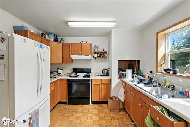 63735 Caribou Ln, Hope, AK 99605 - kitchen featuring freestanding refrigerator, stove, under cabinet range hood, light countertops, and brown cabinets