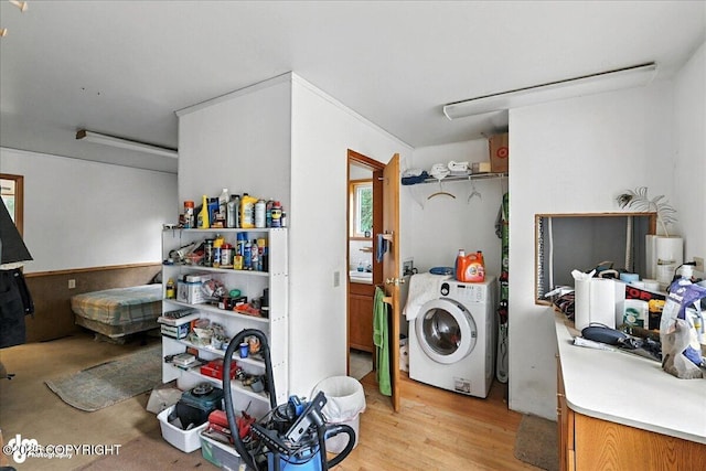 63735 Caribou Ln, Hope, AK 99605 - laundry area featuring washer / clothes dryer and light wood-type flooring