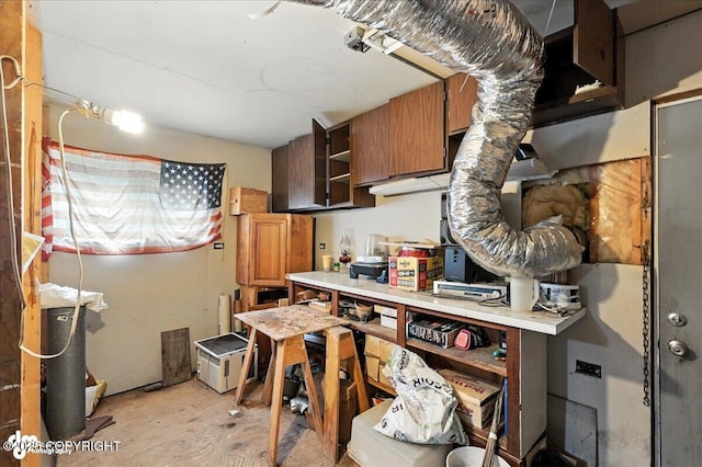63735 Caribou Ln, Hope, AK 99605 - kitchen featuring light countertops, open shelves, and brown cabinetry