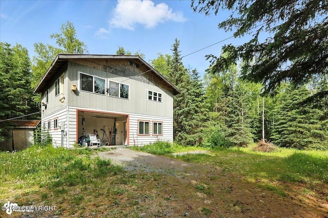 63735 Caribou Ln, Hope, AK 99605 - rear view of house featuring driveway