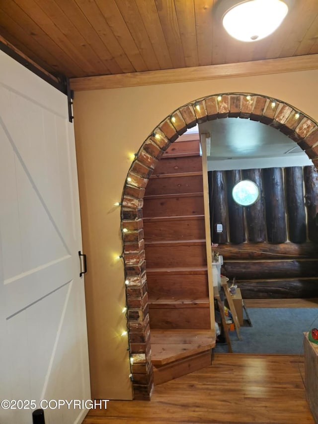 22120 S Easy St, Talkeetna, AK 99676 - stairway with arched walkways, wooden ceiling, wood finished floors, and a barn door