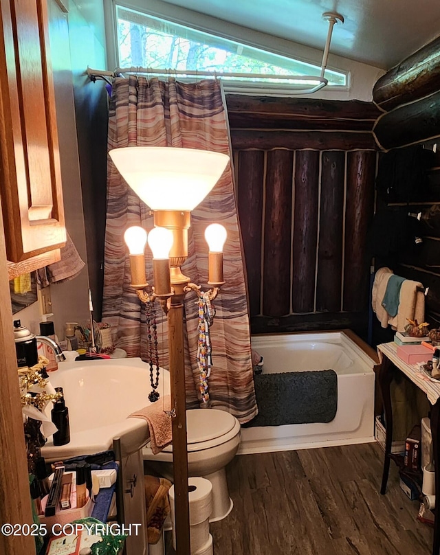 22120 S Easy St, Talkeetna, AK 99676 - full bathroom featuring a tub to relax in, wood finished floors, healthy amount of natural light, and vanity