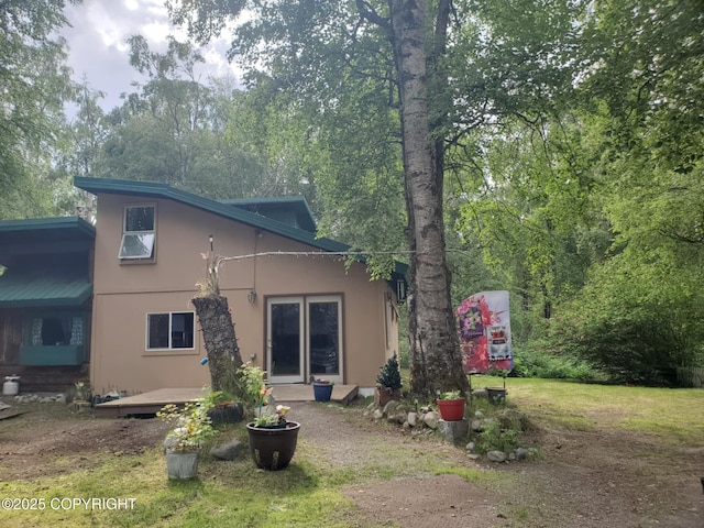 22120 S Easy St, Talkeetna, AK 99676 - rear view of house with stucco siding