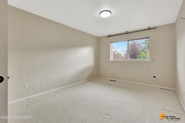 7612 Lumbis Ave # 4, Anchorage, AK 99518 - empty room with carpet floors and baseboards
