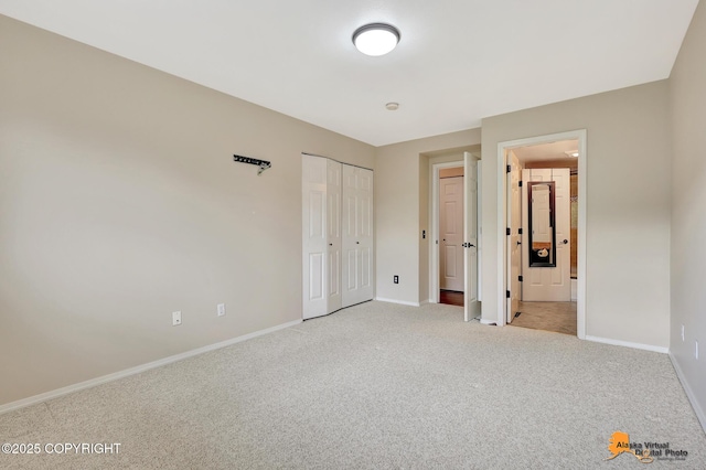 7612 Lumbis Ave # 4, Anchorage, AK 99518 - unfurnished bedroom featuring light colored carpet and a closet