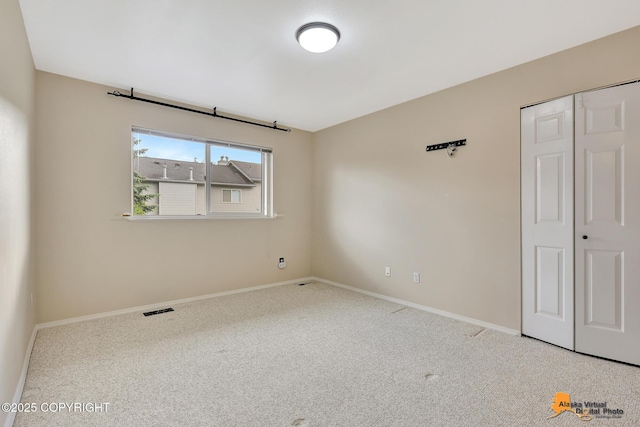 7612 Lumbis Ave # 4, Anchorage, AK 99518 - carpeted empty room with baseboards
