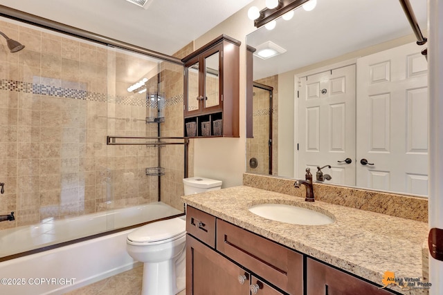 7612 Lumbis Ave # 4, Anchorage, AK 99518 - bathroom featuring vanity, shower / bath combination with glass door, and tile patterned floors